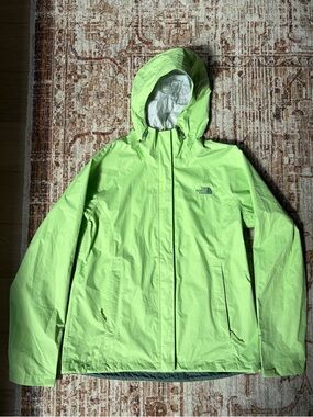 The North Face women’s size medium waterproof rain jacket in lime green